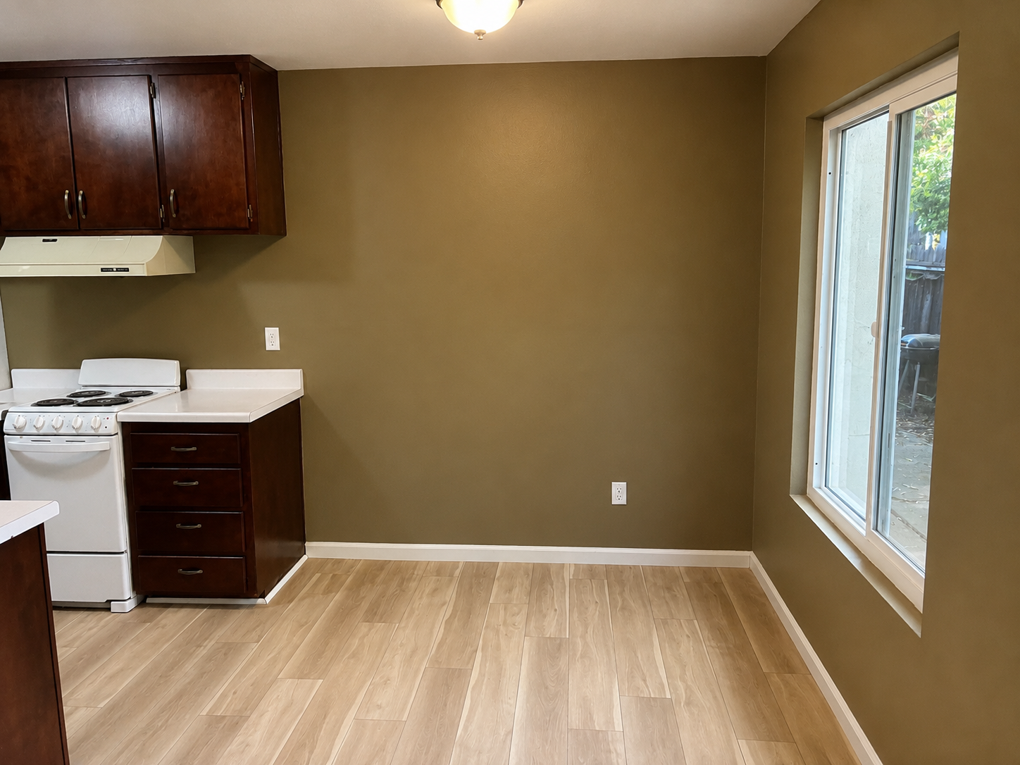 Kitchen with wood cabinets and appliances